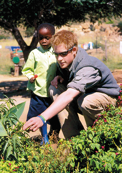 LESOTHO - UNDATED: In this undated Clarence House handout photo, Prince Harry with Mutsu at the Mants-Afe Children's Home, in Lesotho. Prince Harry has thanked the public for its generosity following his recent trip to Lesotho where he revisited community projects he worked on during his gap year. The prince returned to the southern African country last month to see first-hand how much progress had been made and to hand over items from the British Red Cross Lesotho Fund. (Photo by ROTA/Anwar Hussein Collection/Getty Images)